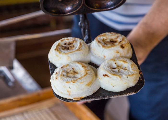 Four freshly grilled umegai mochi.